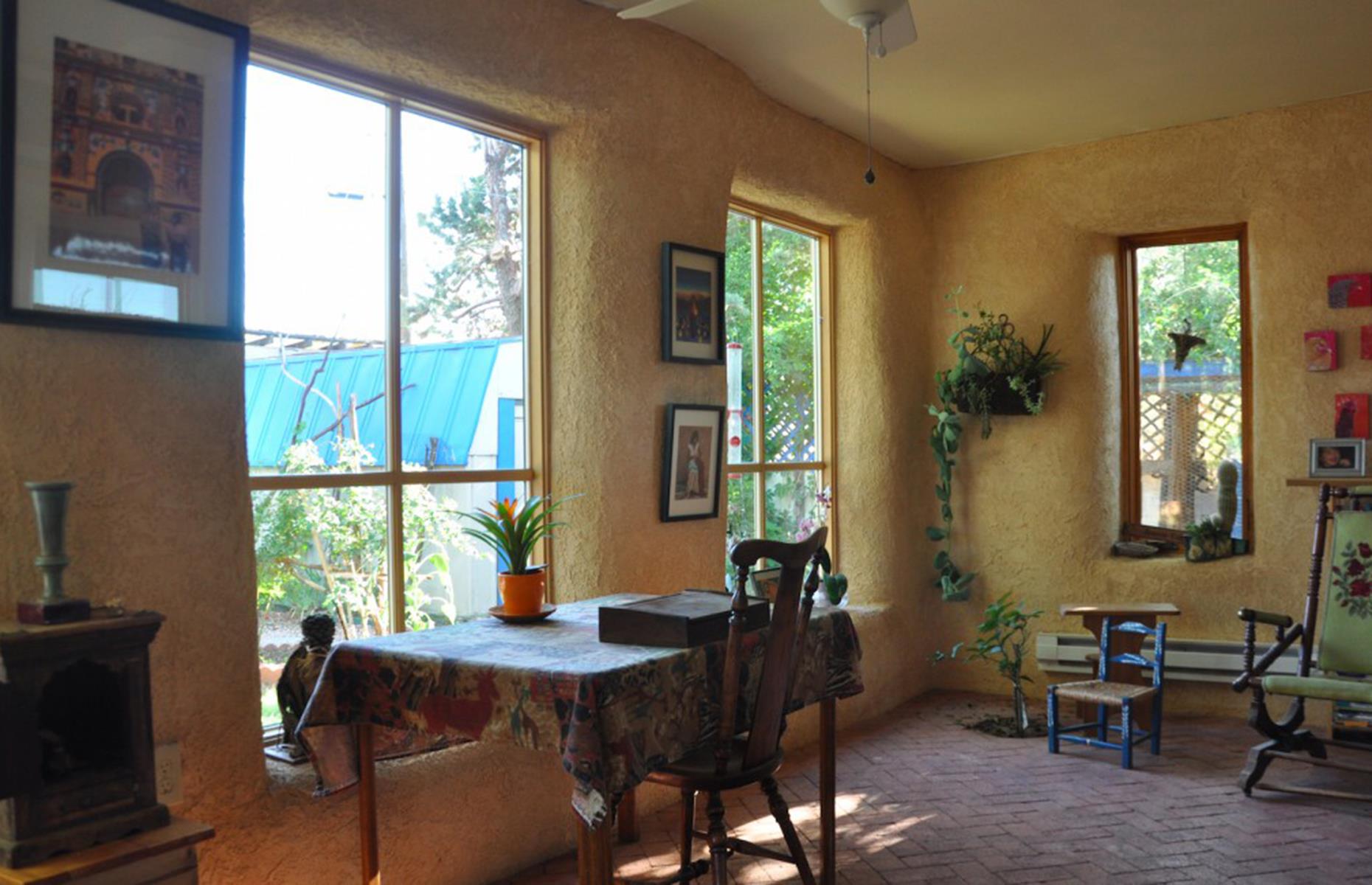 Pale pink straw bale house, New Mexico, USA